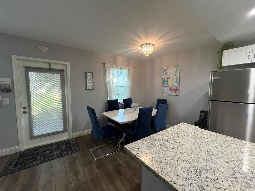 418 Durham, Unit 418 Deerfield Beach, FL 33442 - Photo 24 of 47 a view of a kitchen and dining room