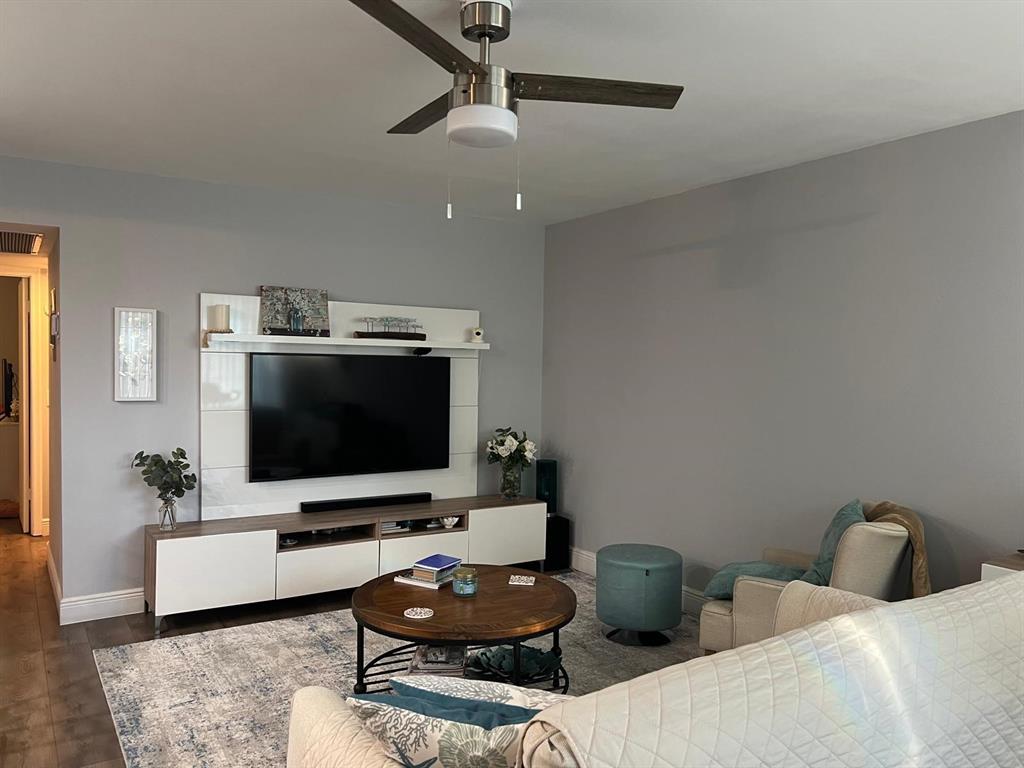 418 Durham, Unit 418 Deerfield Beach, FL 33442 - Photo 27 of 47 a living room with furniture and a flat screen tv