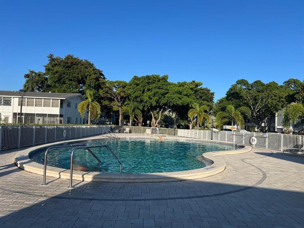 418 Durham, Unit 418 Deerfield Beach, FL 33442 - Photo 31 of 47 a view of a house with backyard and sitting area