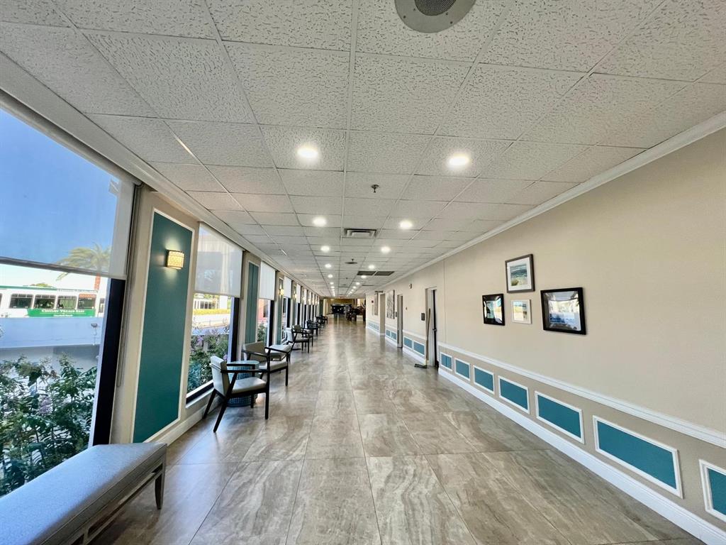 418 Durham, Unit 418 Deerfield Beach, FL 33442 - Photo 42 of 47 a view of a hall with wooden floor