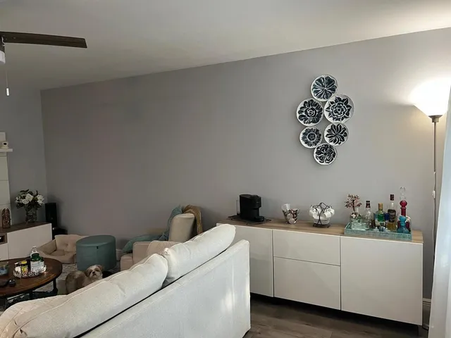 a livingroom with a window and furniture