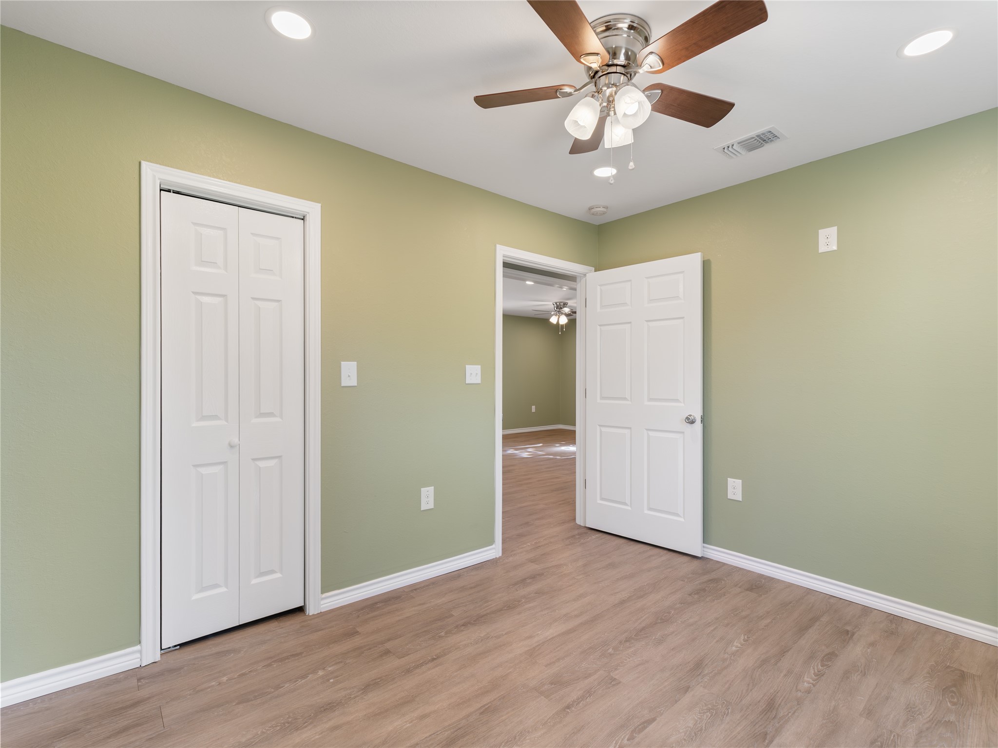 2110 Horn Road Bay City, TX 77414 - Photo 7 of 11 wooden floor in an empty room with a window