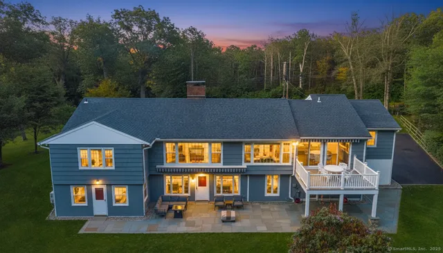 a aerial view of a house with swimming pool and porch