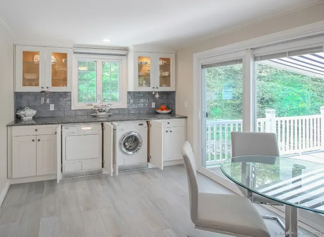 a kitchen with a stove a sink and a refrigerator