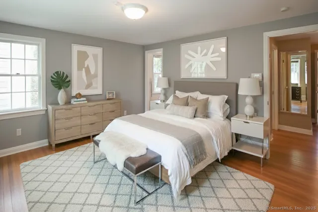 a bedroom with a bed and window