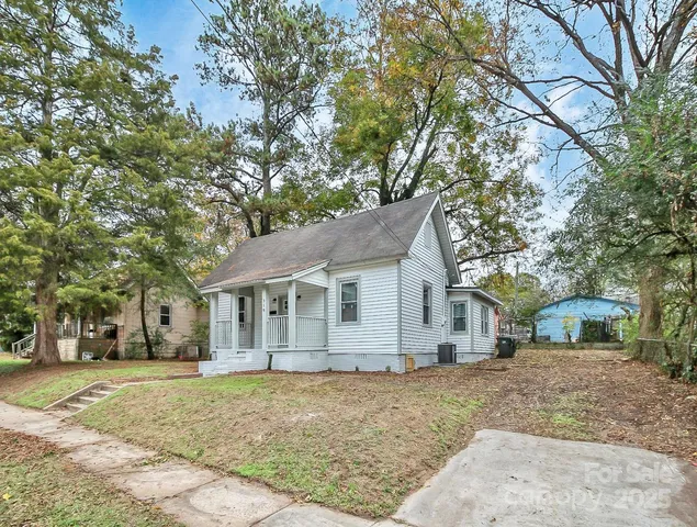 a house with trees in the background