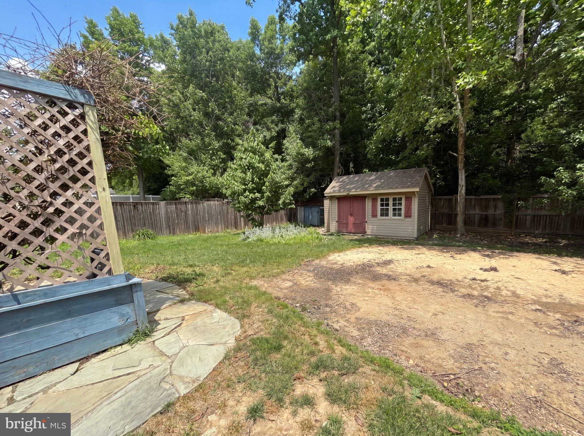 7923 Fawn Run Jessup, MD 20794 - Photo 22 of 22 Serene backyard with charming shed.
