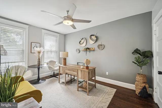 a workspace with furniture and a window