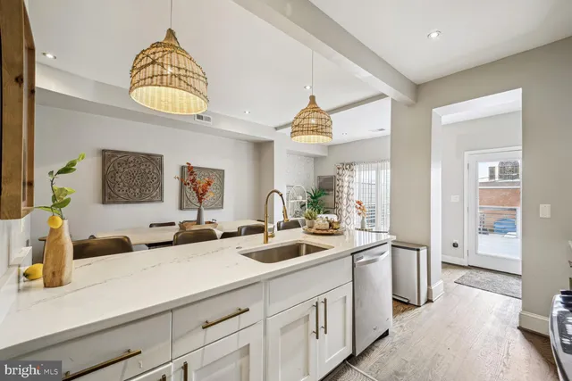 a bathroom with a sink a mirror and a window