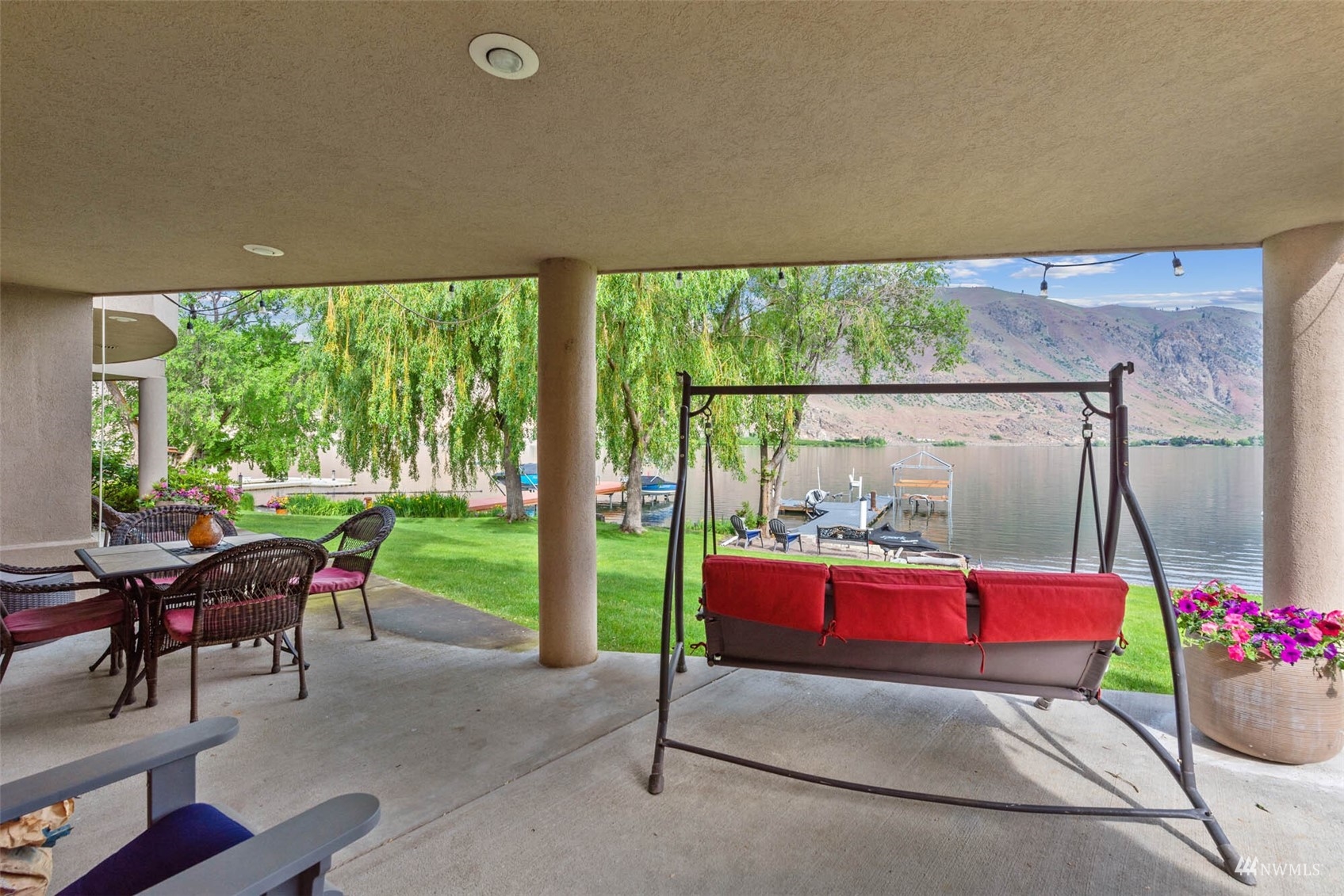 13699 Whitebird Place Orondo, WA 98843 - Photo 34 of 36 a building outdoor space with patio furniture and potted plants