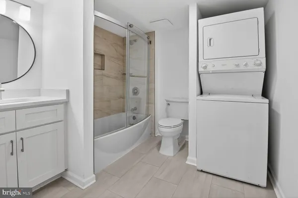 a bathroom with a toilet a sink and a bathtub