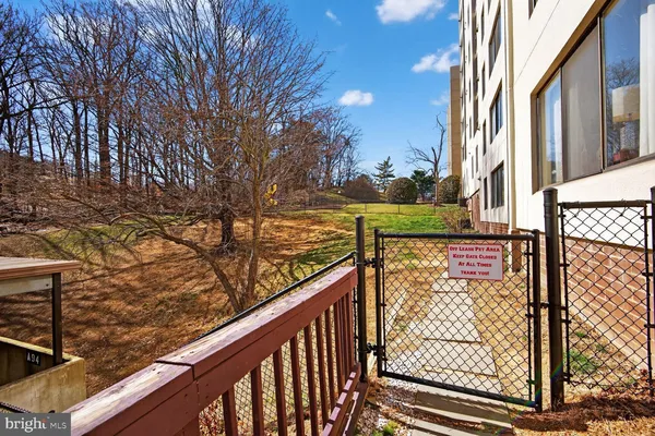 a view of a balcony with a trees
