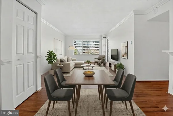 a view of a dining room with furniture window and wooden floor