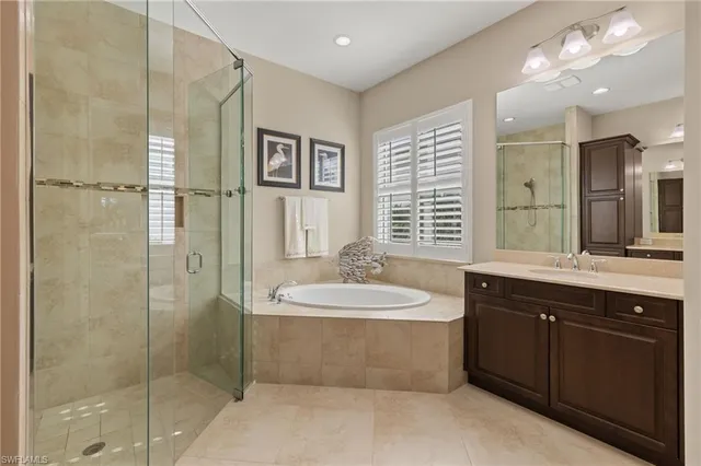 a living room with a bed furniture and a window