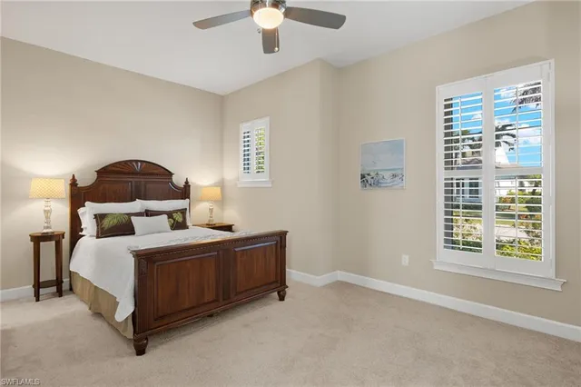 a bathroom with a granite countertop sink toilet a mirror and shower