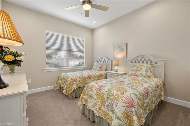 a bathroom with a granite countertop sink a toilet and a mirror