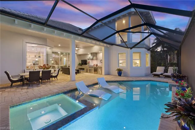 a view of a backyard with sitting area