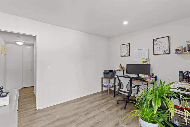 a workspace with furniture and wooden floor
