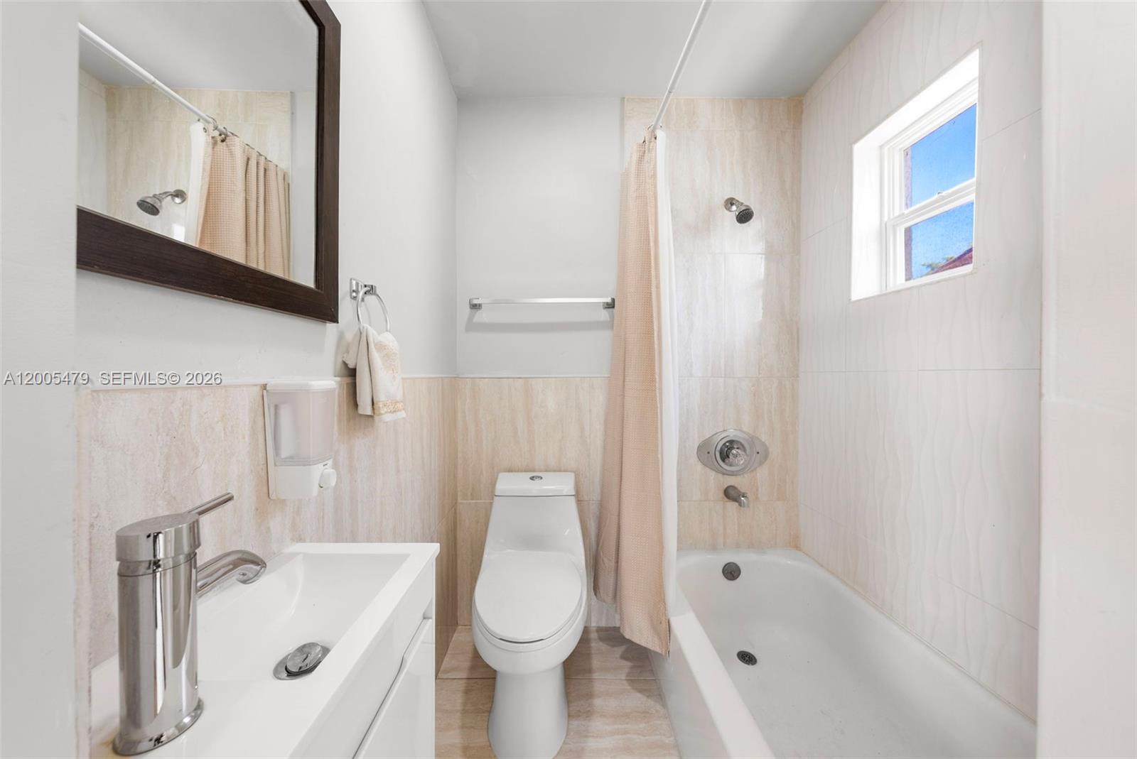 31 Northwest 108th Court, Unit E Miami, FL 33172 - Photo 3 of 5 a bathroom with a sink a toilet and shower