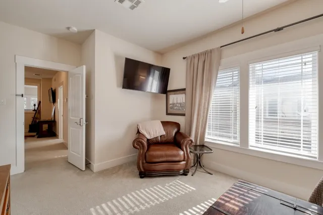 a living room with furniture and a window