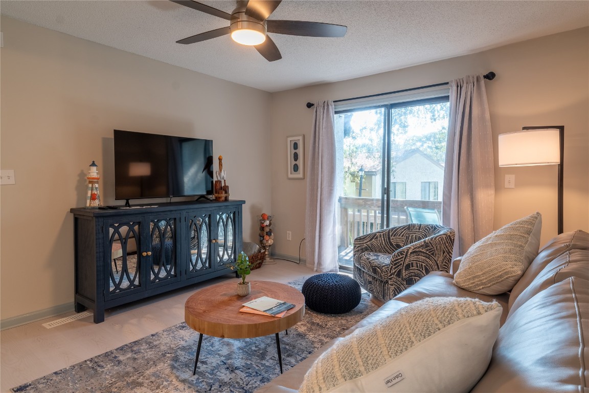 2582 Forest Ridge Drive, Unit N2 Fernandina Beach, FL 32034 - Photo 11 of 30 a living room with furniture and a flat screen tv