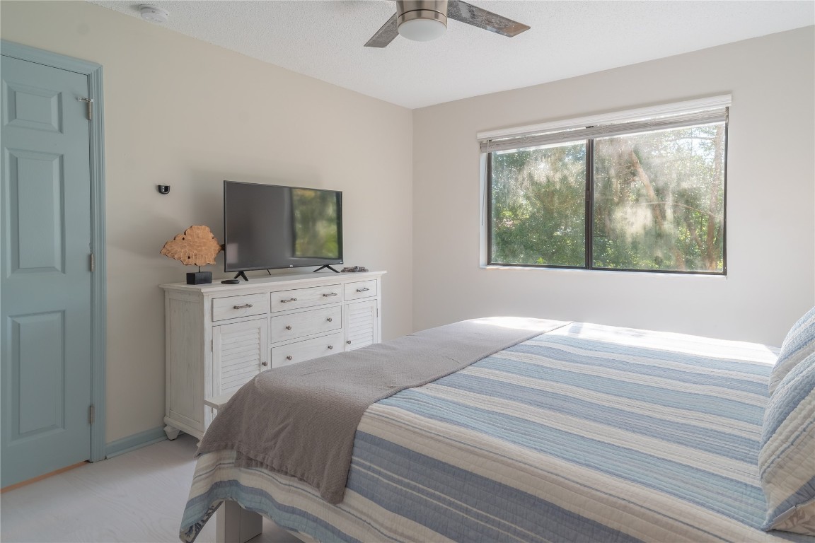 2582 Forest Ridge Drive, Unit N2 Fernandina Beach, FL 32034 - Photo 25 of 30 a bedroom with a bed and a dresser in it