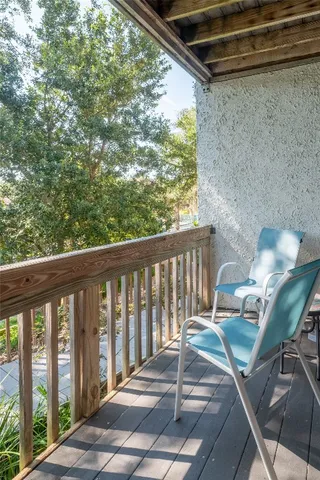 a view of a balcony with chair