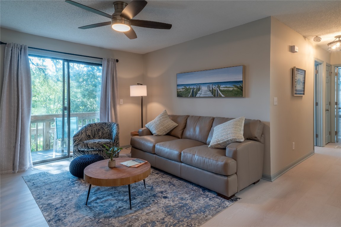 2582 Forest Ridge Drive, Unit N2 Fernandina Beach, FL 32034 - Photo 3 of 30 a living room with furniture and a large window