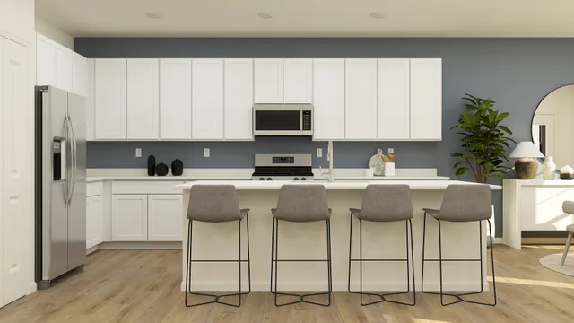 a kitchen with cabinets appliances and a window