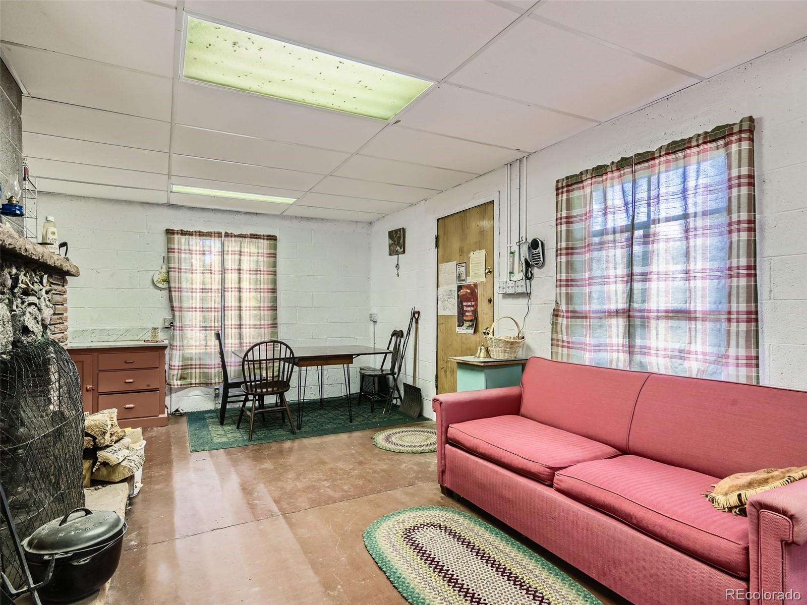 105 Royal Lane Bailey, CO 80421 - Photo 2 of 11 a living room with furniture and a window