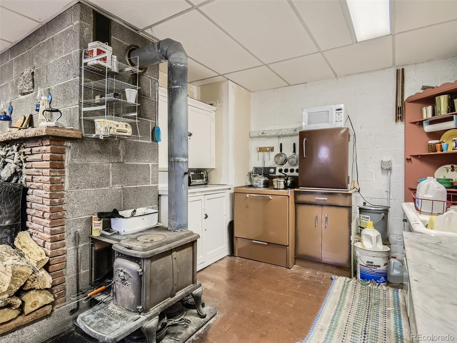 105 Royal Lane Bailey, CO 80421 - Photo 4 of 11 a kitchen with a sink appliances and cabinets
