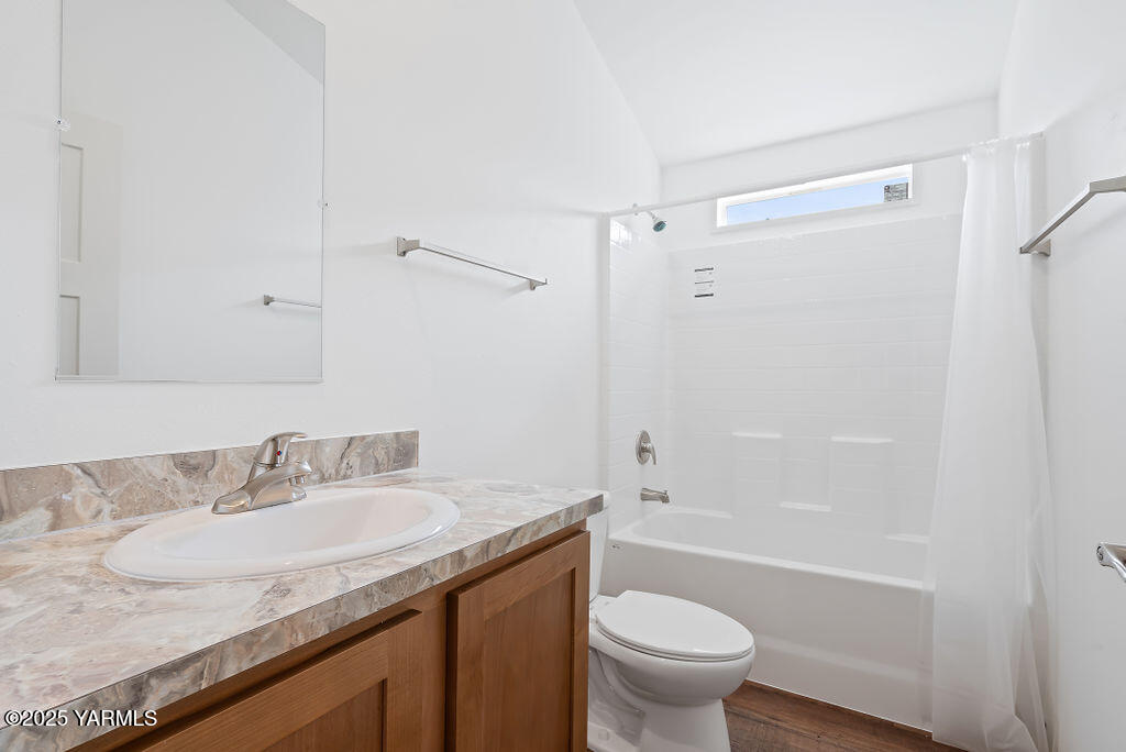 1418 Hathaway Street, Unit 24A Yakima, WA 98902 - Photo 12 of 12 a bathroom with a granite countertop sink toilet and shower