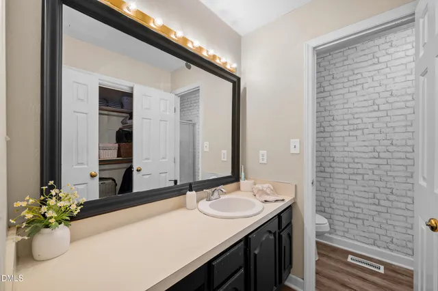 a bedroom with a bed and a desk in it