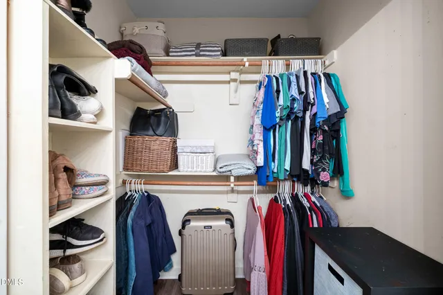 a kitchen with a table chairs and a ceiling fan