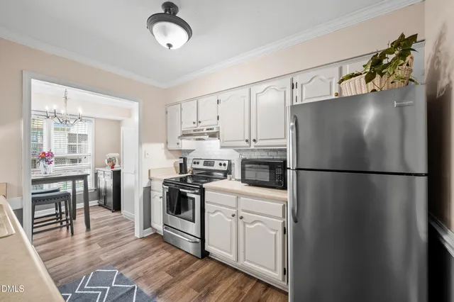a spacious bedroom with a bed and a window