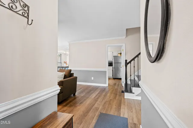 a kitchen with stainless steel appliances a refrigerator sink and cabinets