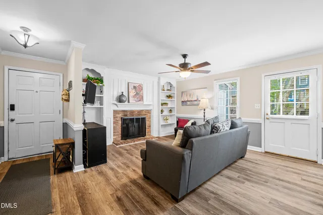 a living room with furniture and a fireplace