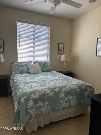 a bedroom with a bed and window