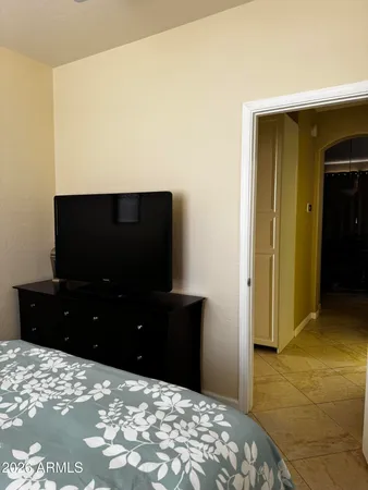 a bedroom with a bed and a closet