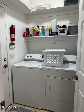 a utility room with dryer and washer