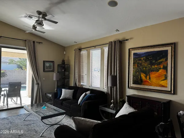 a living room with furniture and a large window