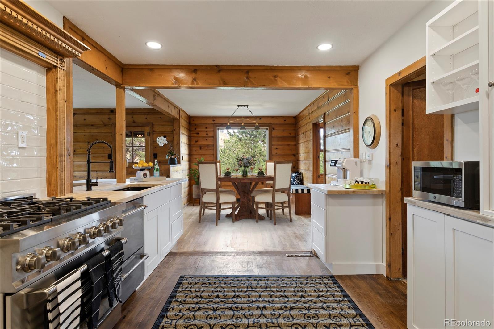 34200 Sioux Trail Pine, CO 80470 - Photo 13 of 37 a kitchen with stainless steel appliances granite countertop a stove a sink and a refrigerator
