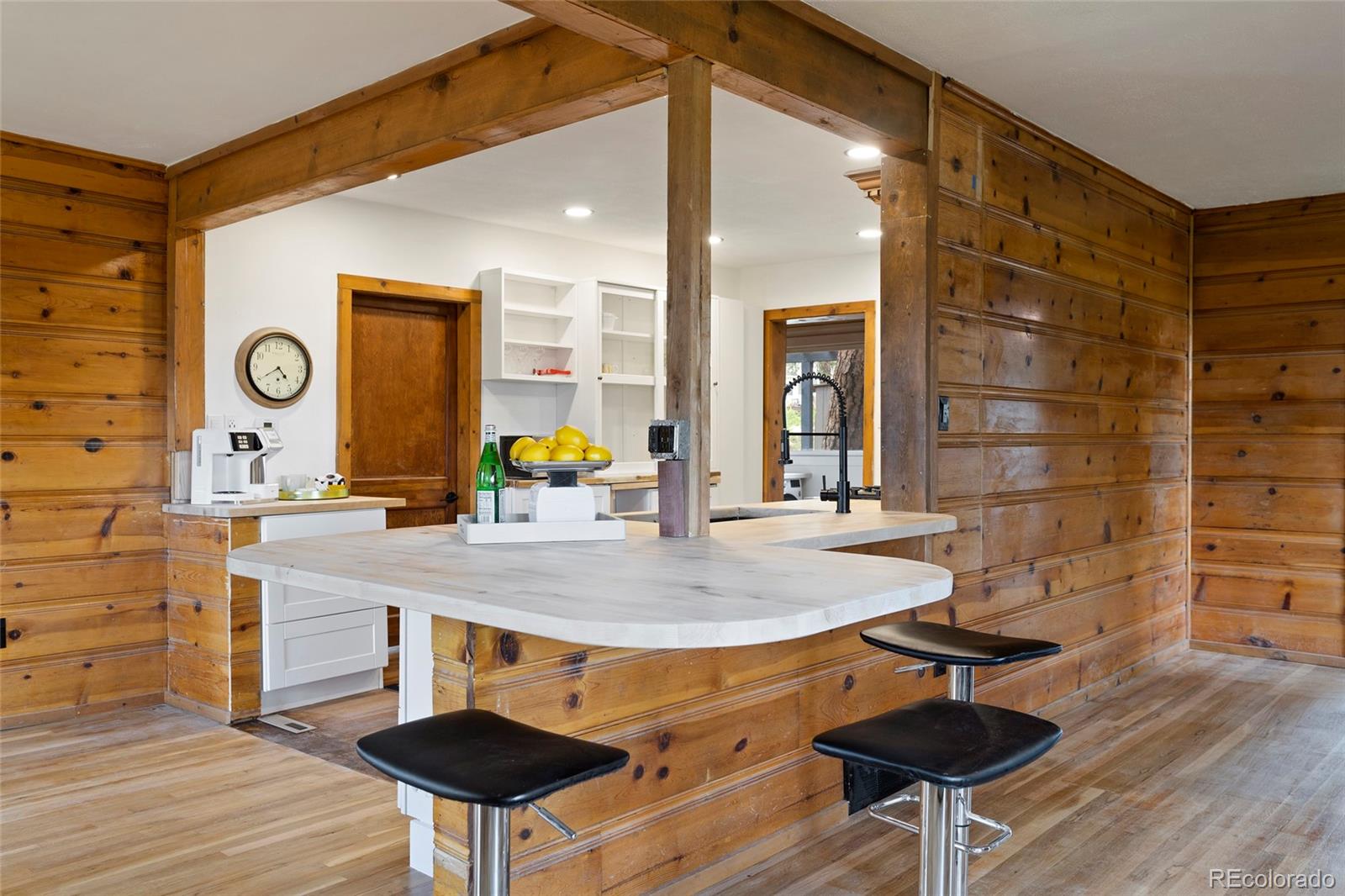 34200 Sioux Trail Pine, CO 80470 - Photo 16 of 37 a view of a kitchen with table and chairs