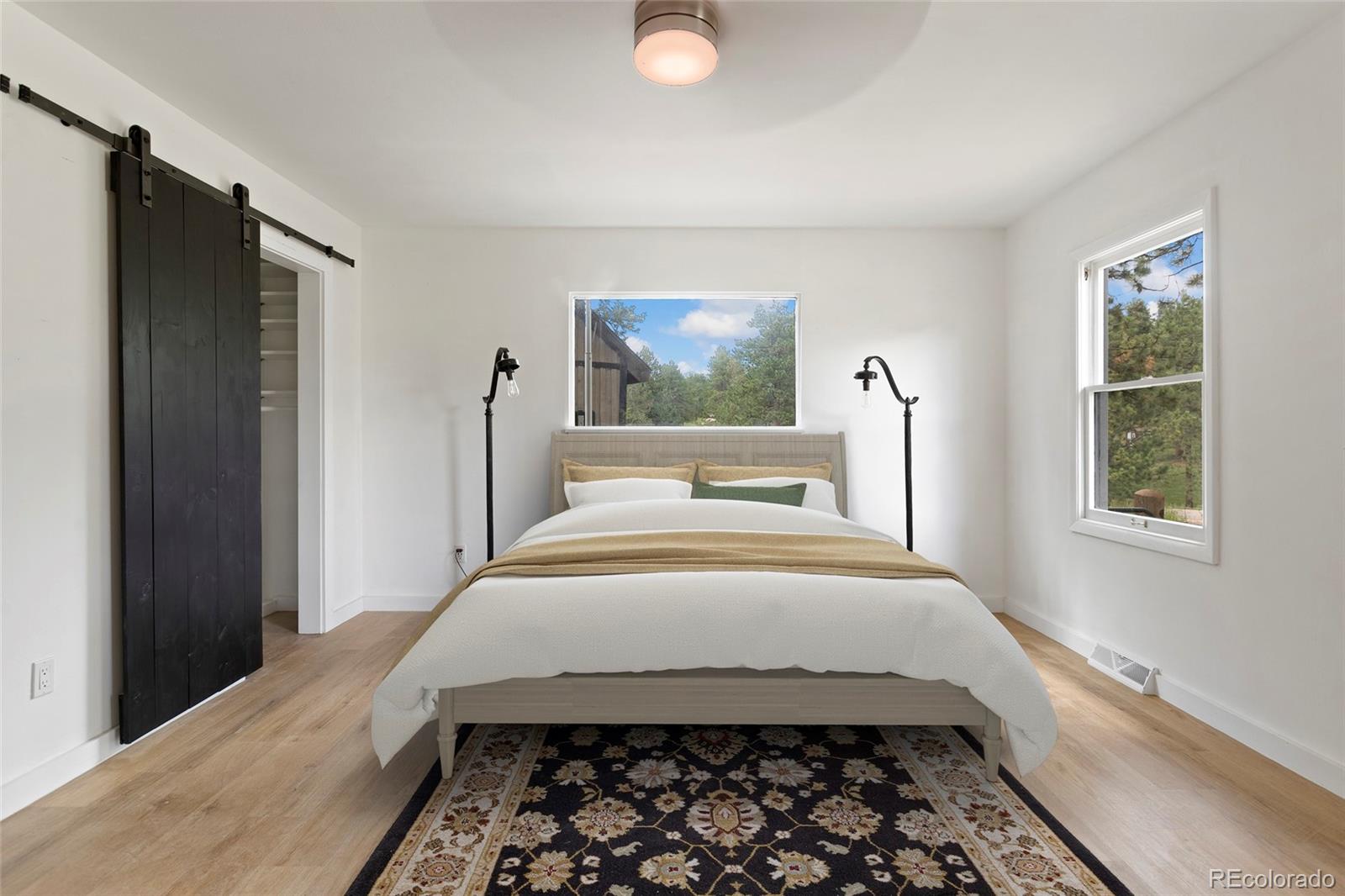 34200 Sioux Trail Pine, CO 80470 - Photo 17 of 37 a bedroom with bed and a window