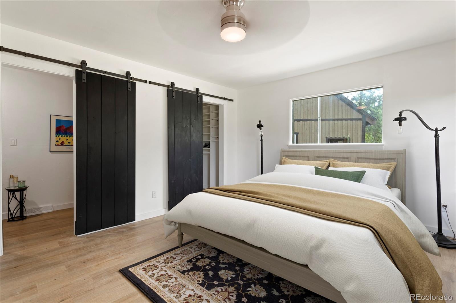 34200 Sioux Trail Pine, CO 80470 - Photo 18 of 37 a bedroom with a bed and a window