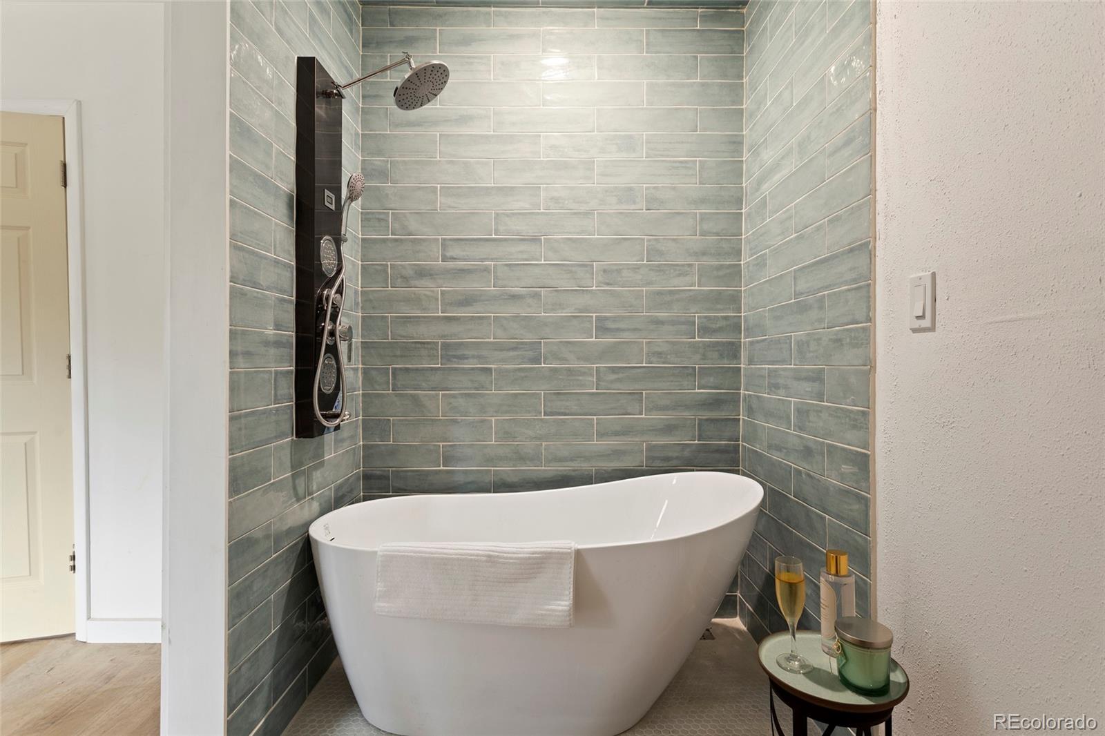 34200 Sioux Trail Pine, CO 80470 - Photo 19 of 37 a white bath tub sitting in a bathroom