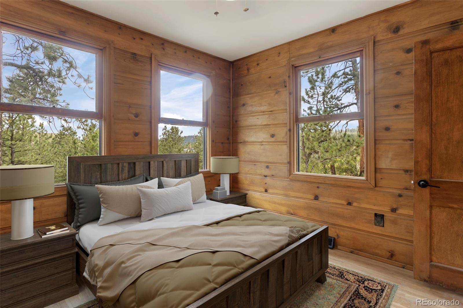 34200 Sioux Trail Pine, CO 80470 - Photo 20 of 37 a bedroom with a bed and a window