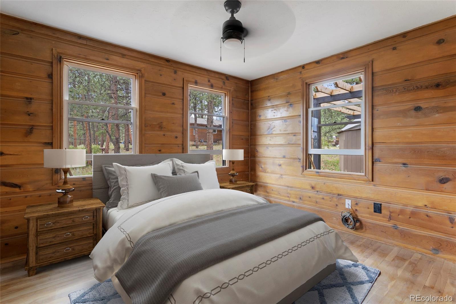 34200 Sioux Trail Pine, CO 80470 - Photo 22 of 37 a bedroom with a bed and a window