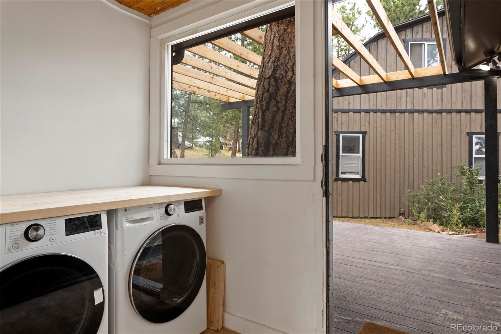 34200 Sioux Trail Pine, CO 80470 - Photo 23 of 37 a view of livingroom with washer and dryer
