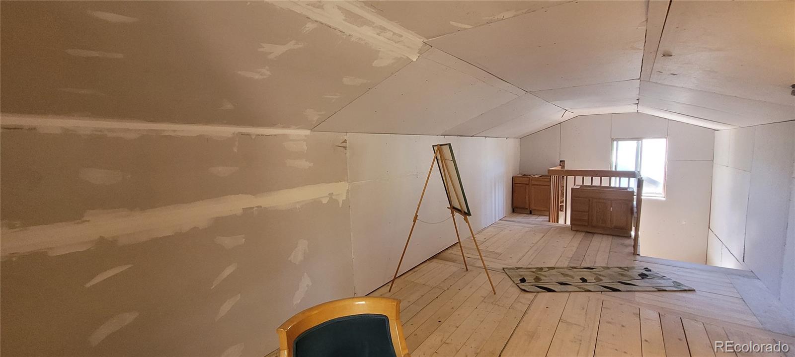 34200 Sioux Trail Pine, CO 80470 - Photo 24 of 37 a view of a livingroom with wooden floor